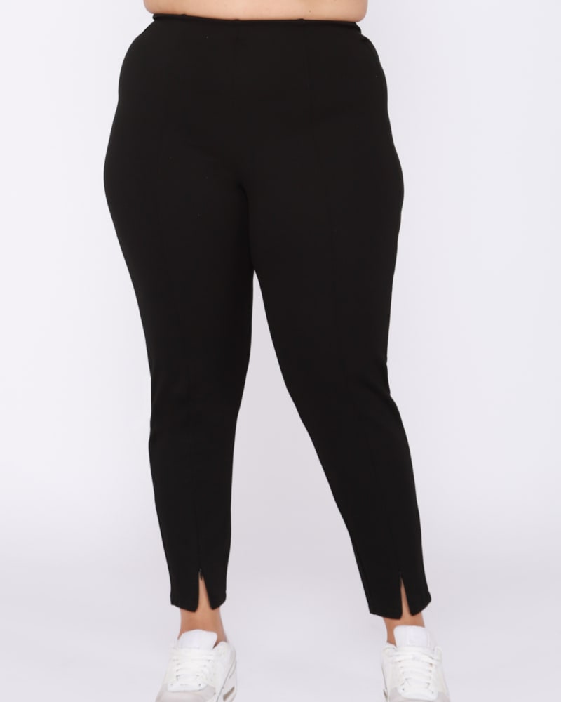 Front of a model wearing a size 0X Jina Zip Slit Front Leggings in Black by DEX PLUS. | dia_product_style_image_id:237825